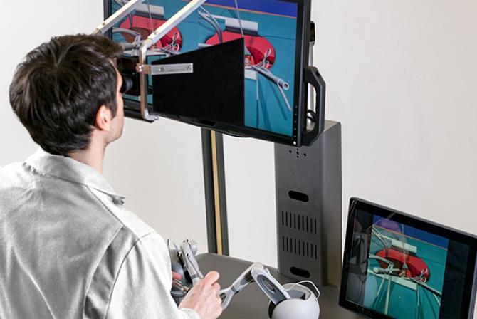Researcher testing surgical simulator