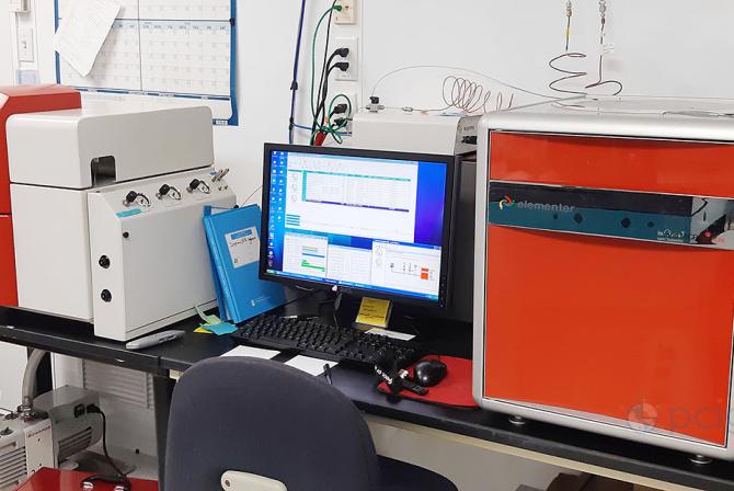 Mass spectrometry system setup on a table in a lab.